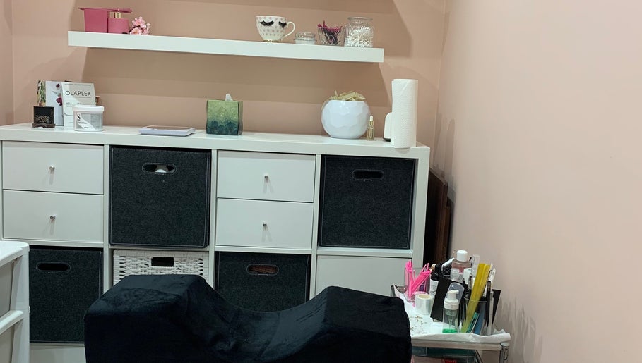 Cozy beauty setup at Aura beauty - Norbury, London, England, GB with shelves and wellness products.