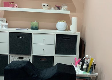 Cozy beauty setup at Aura beauty - Norbury, London, England, GB with shelves and wellness products.