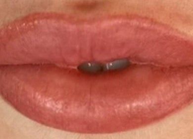 Close-up of pink glossy lips at Aura beauty - Norbury, located in London, England, GB.