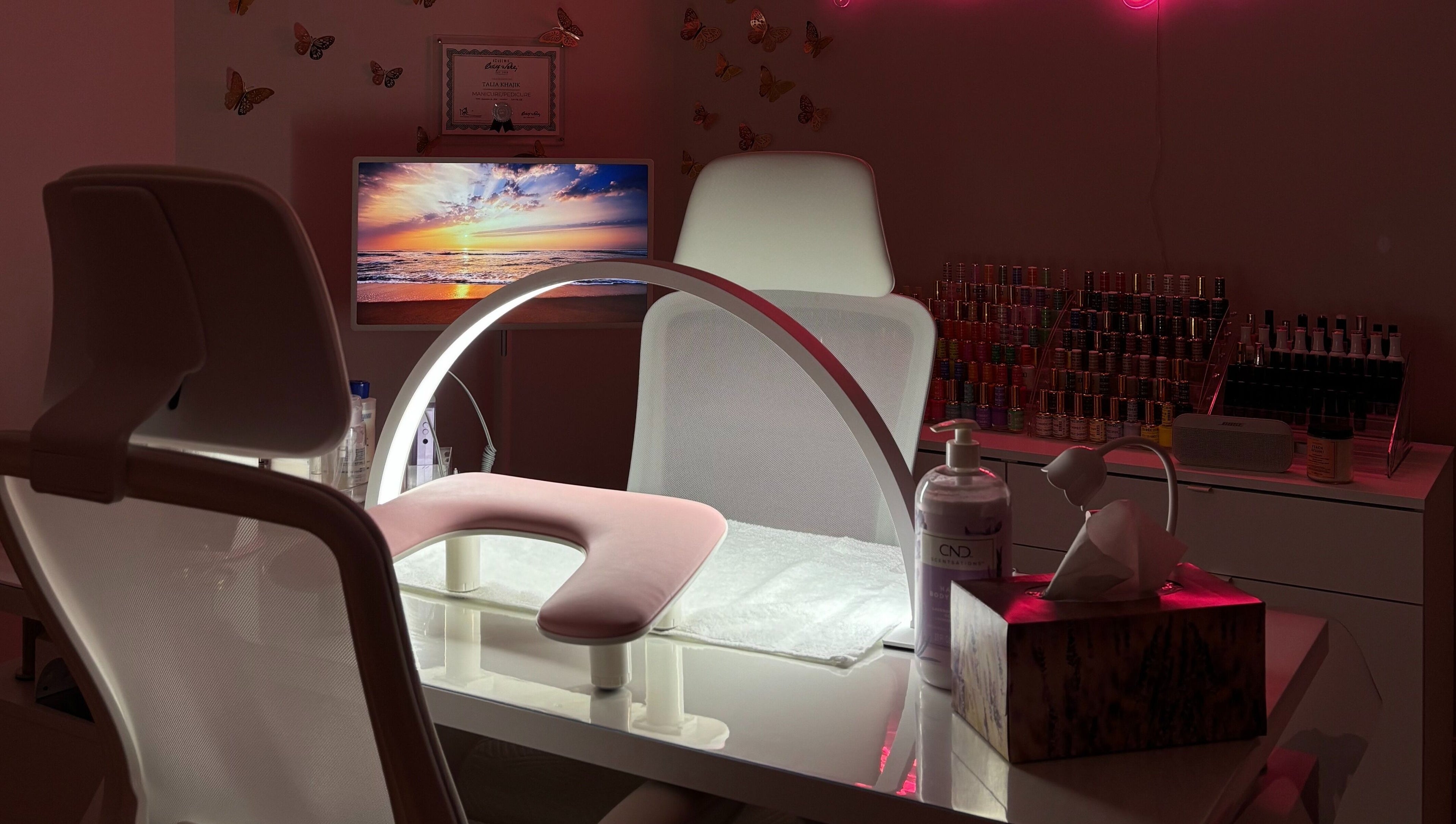 Bright nail station at Polished By Talia, Laval, Québec, CA with elegant decor and manicure tools.