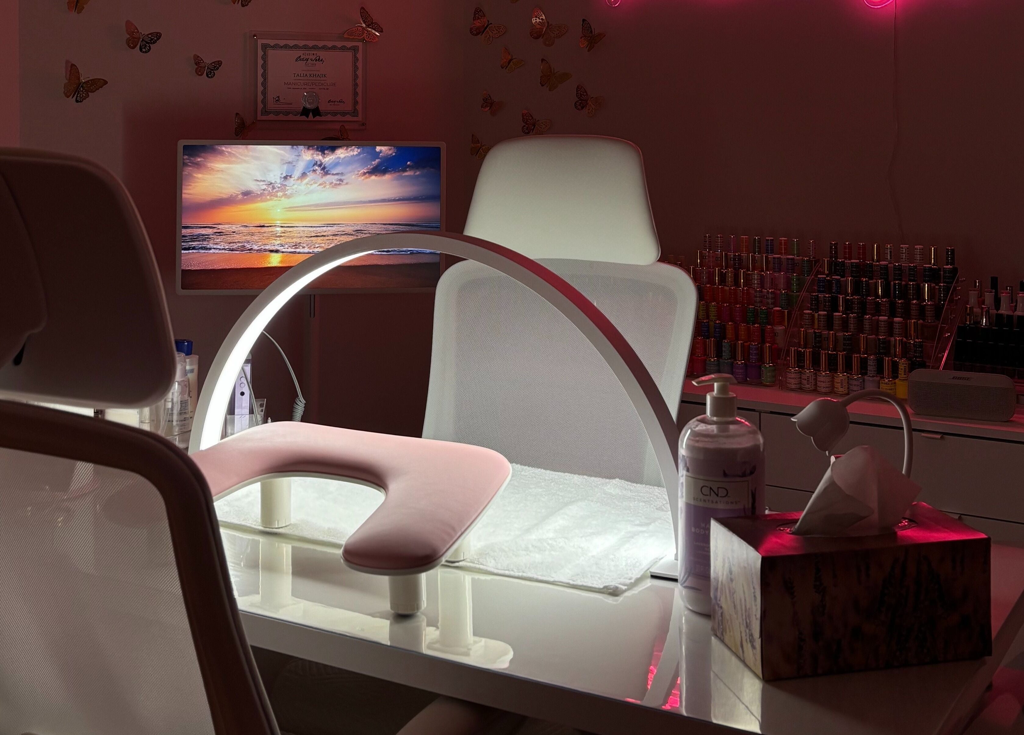 Bright nail station at Polished By Talia, Laval, Québec, CA with elegant decor and manicure tools.
