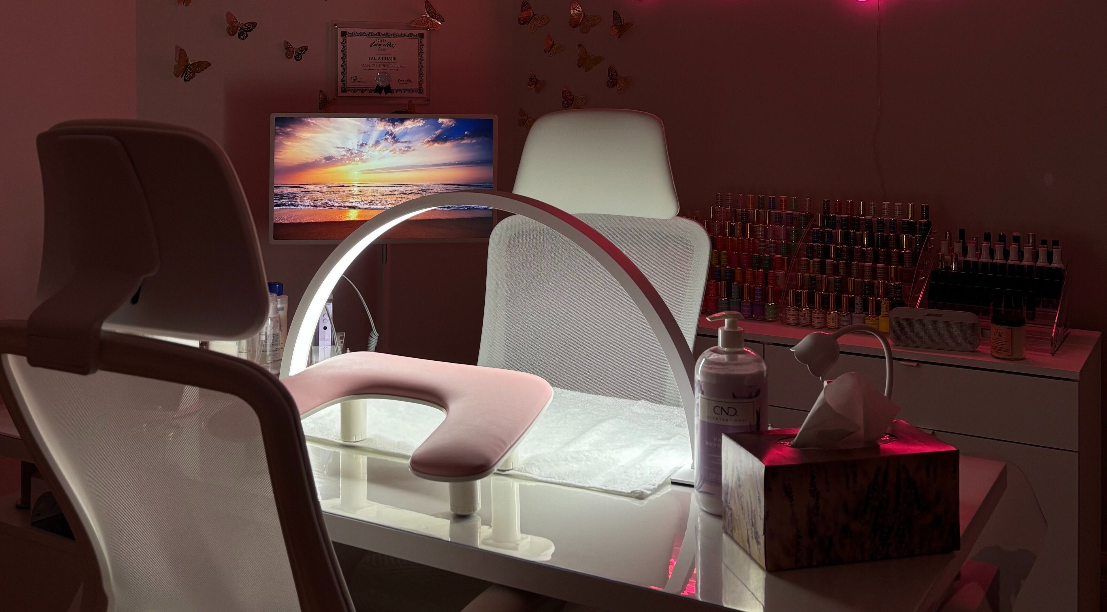 Bright nail station at Polished By Talia, Laval, Québec, CA with elegant decor and manicure tools.
