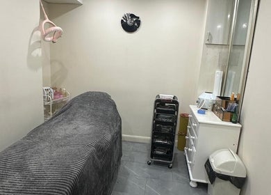 Cozy treatment room at B&B M AESTHETICS AND HAIR in Southall, England, GB offering a serene atmosphere.