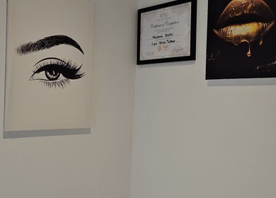 Elegant wall art and certificates at The Sublime Curve of Beauty, Stockport, England, GB.