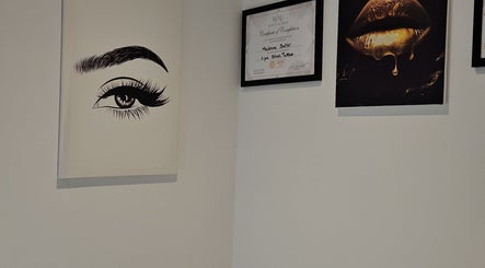 Elegant wall art and certificates at The Sublime Curve of Beauty, Stockport, England, GB.