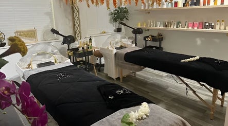 Elegant treatment room at Spa of Rituals, Colchester, England, GB, featuring dual massage beds and serene decor.