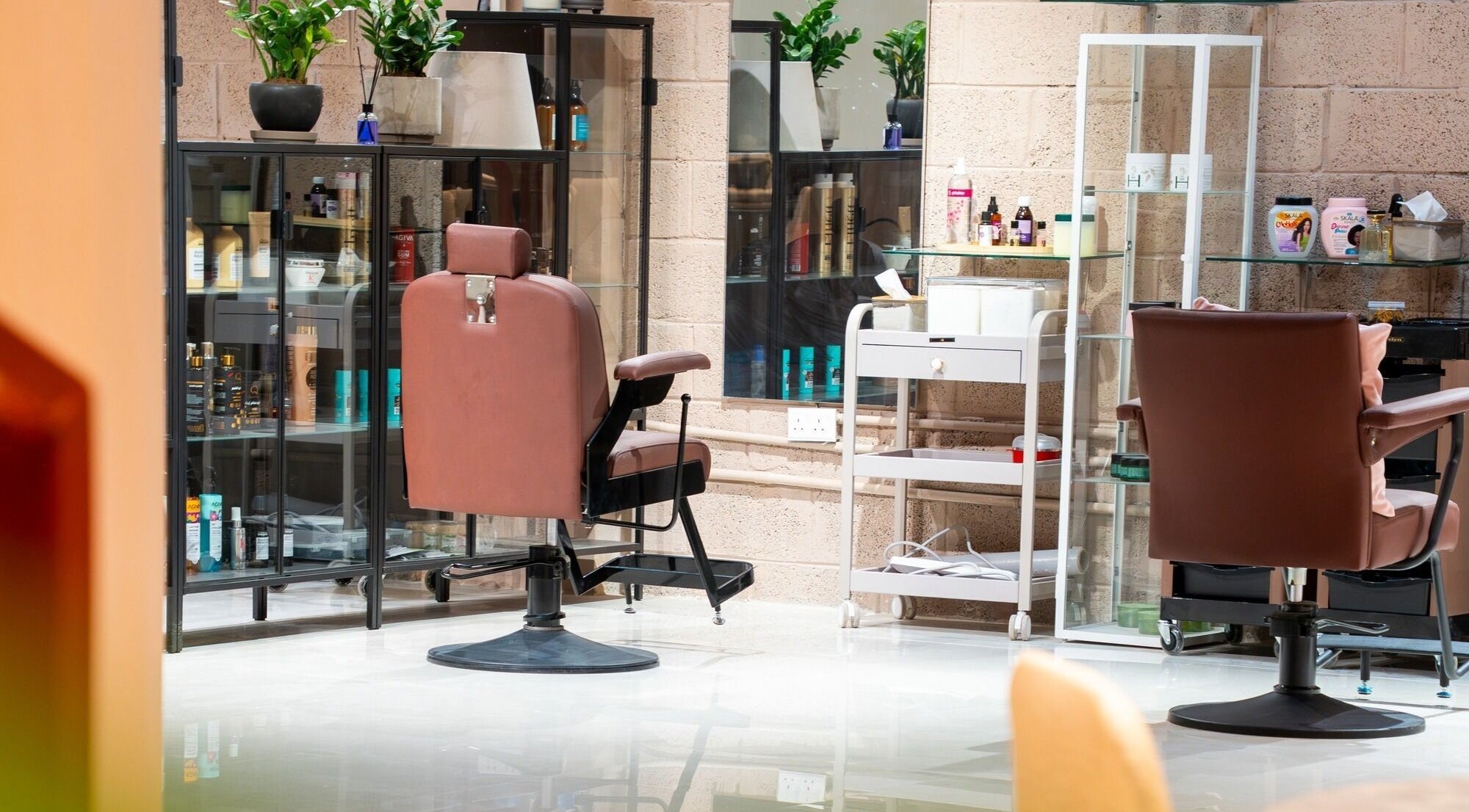 Elegant salon interior with chairs at Markaz Al Funoon, Riyadh, Riyadh Province, SA, inviting relaxation and care.