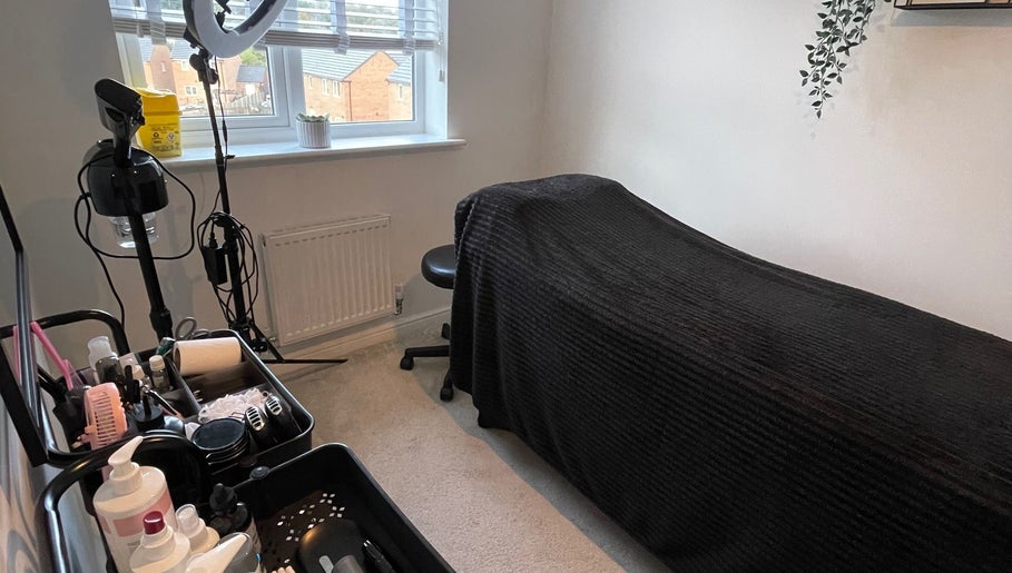 Chic beauty treatment room at Taylormadecosmeticsuk in Mirfield, England, GB showcasing a comfortable setup.