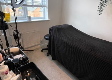 Chic beauty treatment room at Taylormadecosmeticsuk in Mirfield, England, GB showcasing a comfortable setup.