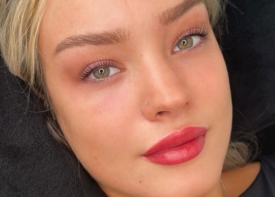 Close-up of a woman with flawless skin and vibrant lips at Taylormadecosmeticsuk, Mirfield, England, GB.