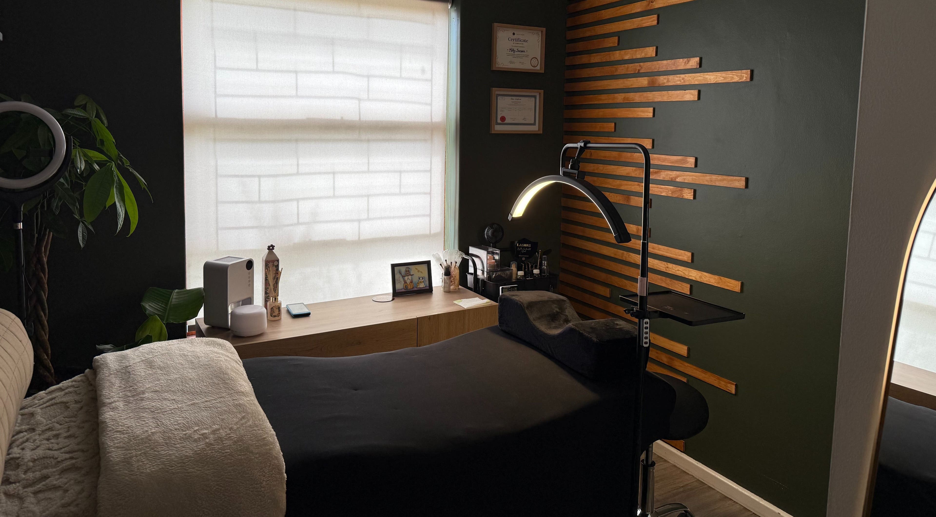 Relaxing treatment room at The Enchanted Wink in Cape Town, Western Cape, ZA with cozy bed and ambient lighting.