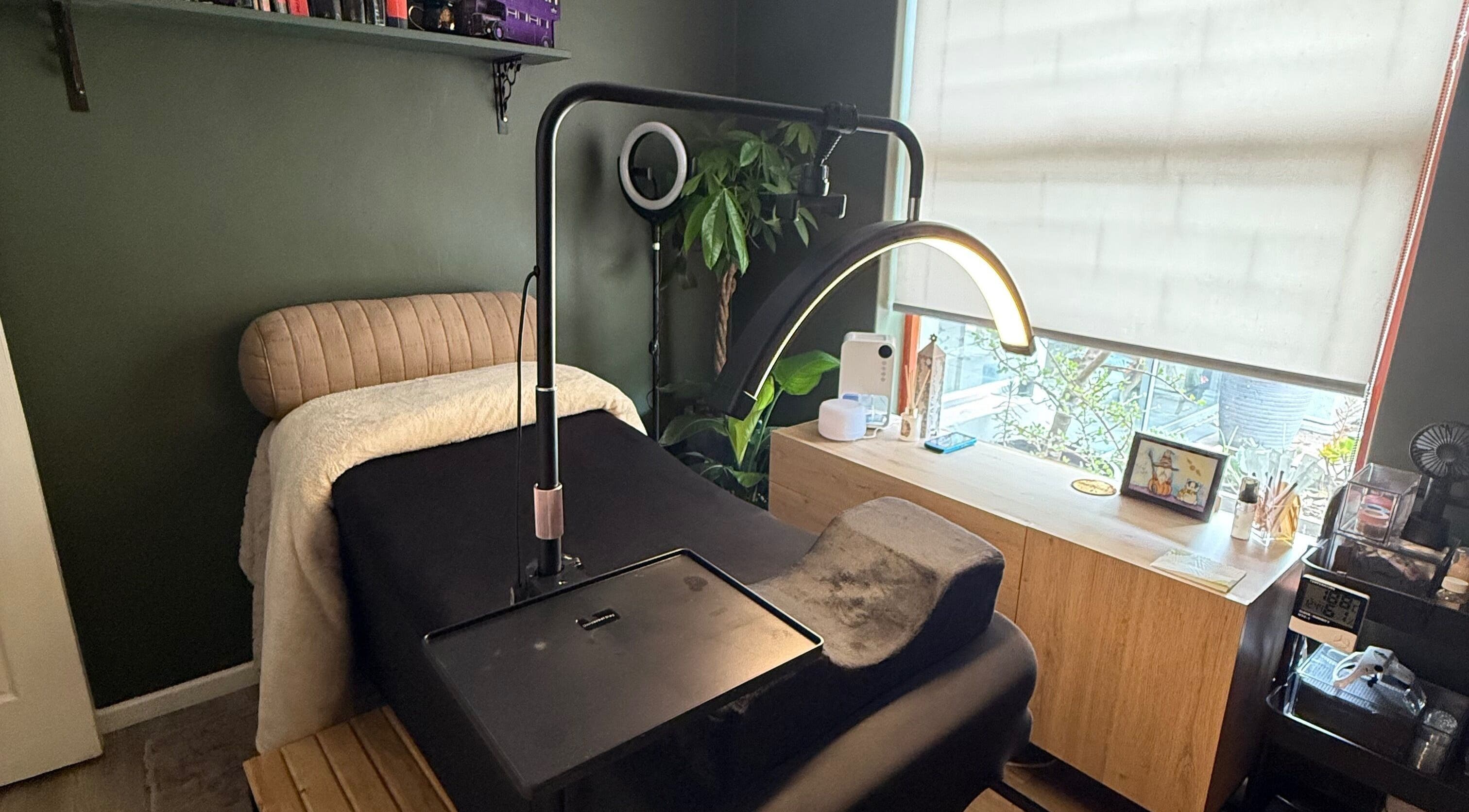 Relaxing treatment area at The Enchanted Wink, Cape Town, Western Cape, ZA with comfy chair and natural light.