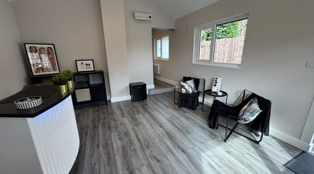 Modern reception area at The Beauty Collective, Ferryhill, England, with stylish decor and seating.