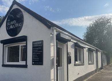 The Beauty Collective, quaint white building exterior in Ferryhill, England, GB with scenic trees.