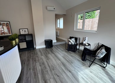 Modern reception area at The Beauty Collective in Ferryhill, England, GB featuring elegant decor and seating.