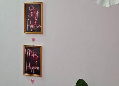 Decorative framed quotes at Glow & Go in Paramaribo, Paramaribo, SR inspire positivity and success.
