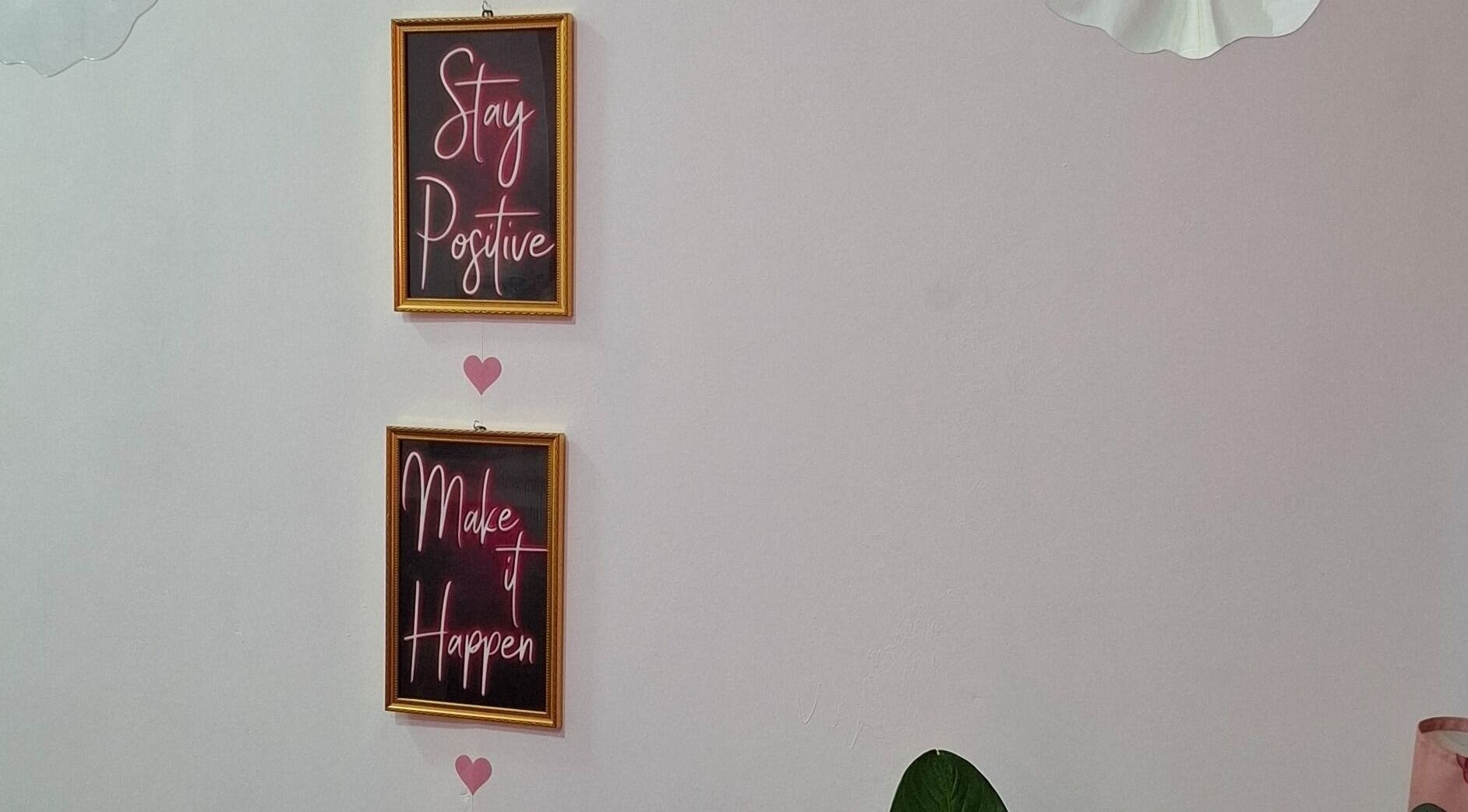 Decorative framed quotes at Glow & Go in Paramaribo, Paramaribo, SR inspire positivity and success.