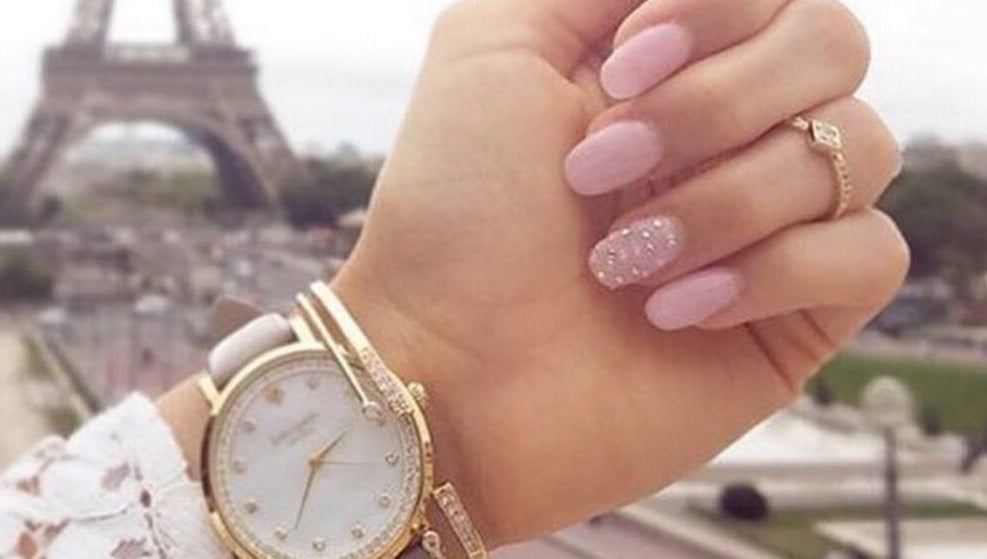Stylish pink manicure with a watch at Narineh in Burbank, California, US, showcasing elegance and beauty.