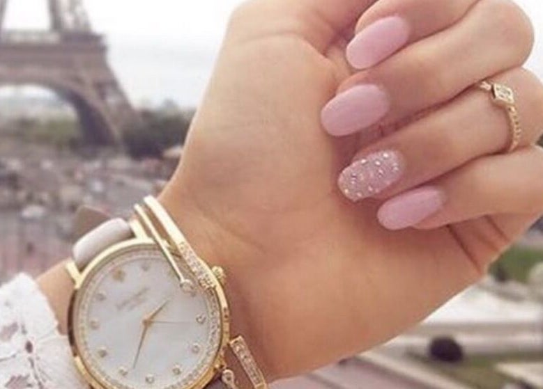Stylish pink manicure with a watch at Narineh in Burbank, California, US, showcasing elegance and beauty.