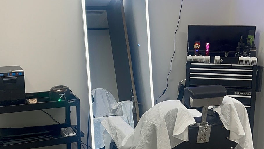 Level Up Barbershop in Manchester, England, GB features a sleek, modern grooming station with professional tools.