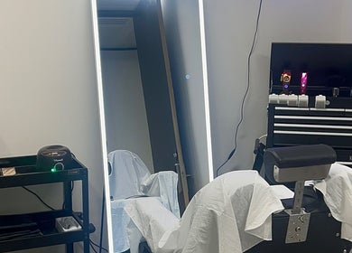 Level Up Barbershop in Manchester, England, GB features a sleek, modern grooming station with professional tools.