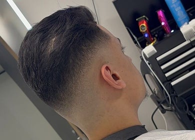 Close-up of a modern haircut at Level Up Barbershop, Manchester, England, GB showcasing professional styling.