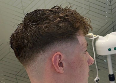 Close-up of stylish fade haircut at Level Up Barbershop. Manchester, England, GB offers modern barbering excellence.