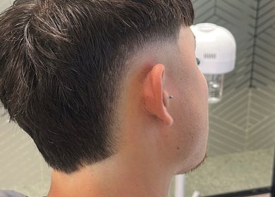 Close-up of a stylish fade haircut at Level Up Barbershop in Manchester, England, GB.