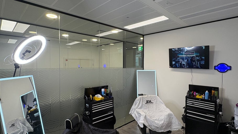 Modern barber setup at Level Up Barbershop, Manchester, England, GB with sleek tools and stylish decor.