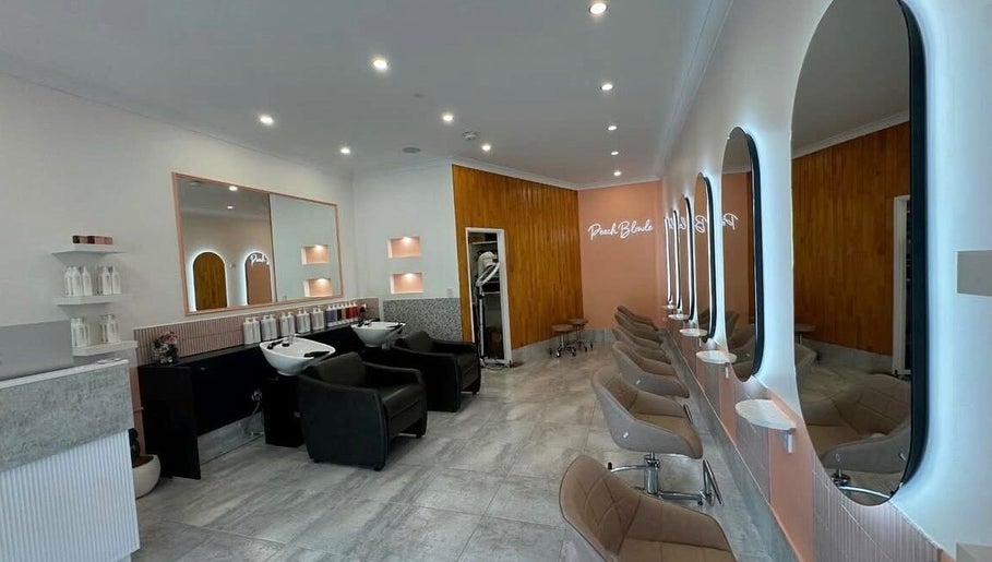 LYS THE STUDIO in Gold Coast, Queensland, AU features modern styling chairs and mirrors in a sleek salon setting.
