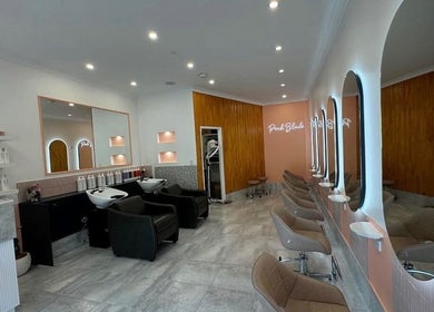 LYS THE STUDIO in Gold Coast, Queensland, AU features modern styling chairs and mirrors in a sleek salon setting.