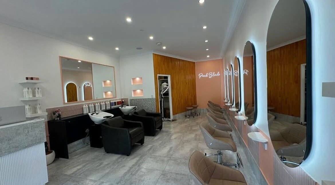 LYS THE STUDIO in Gold Coast, Queensland, AU features modern styling chairs and mirrors in a sleek salon setting.
