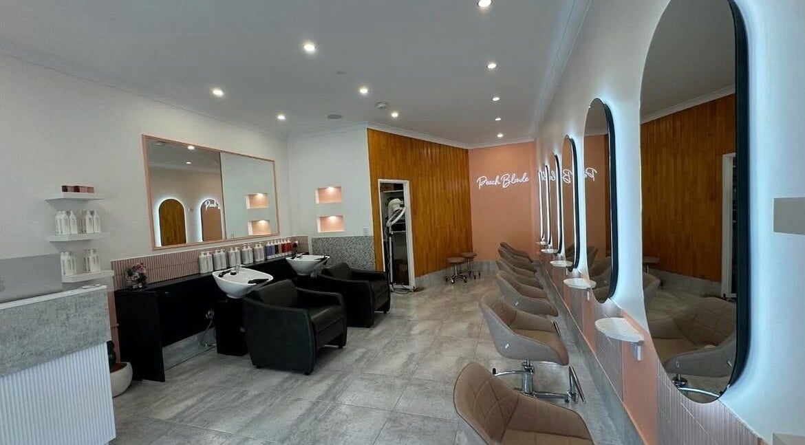 LYS THE STUDIO in Gold Coast, Queensland, AU features modern styling chairs and mirrors in a sleek salon setting.