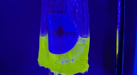 Neon IV bag glowing at Striver IV Vitamin Infusion, Chicago, Illinois, US spa center.