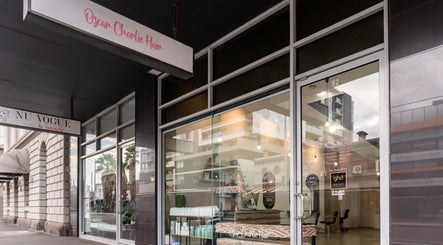 Oscar Charlie Hair entrance in Melbourne, Victoria, AU, showcasing a modern glass storefront.
