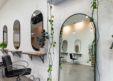 Elegant seating and mirrors at Oscar Charlie Hair, Melbourne, Victoria, AU.