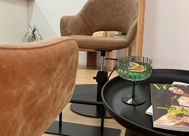 Elegant salon setup at Cloe. Hair Studio, Woolgoolga, New South Wales, AU, with cozy chairs and stylish decor.