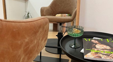 Elegant salon setup at Cloe. Hair Studio, Woolgoolga, New South Wales, AU, with cozy chairs and stylish decor.