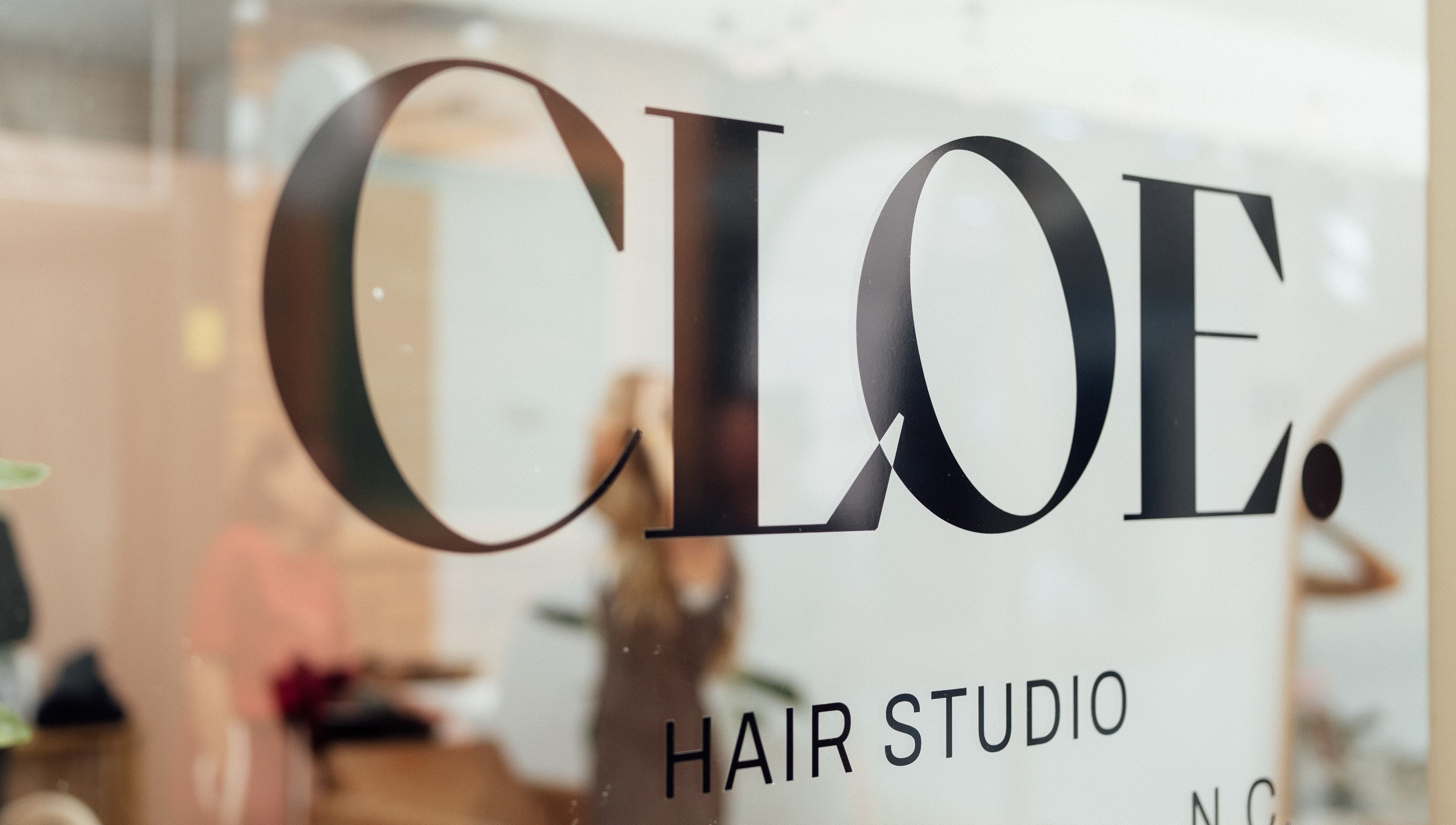 Elegant signage of Cloe. Hair Studio in Woolgoolga, New South Wales, AU, reflecting modern salon design.