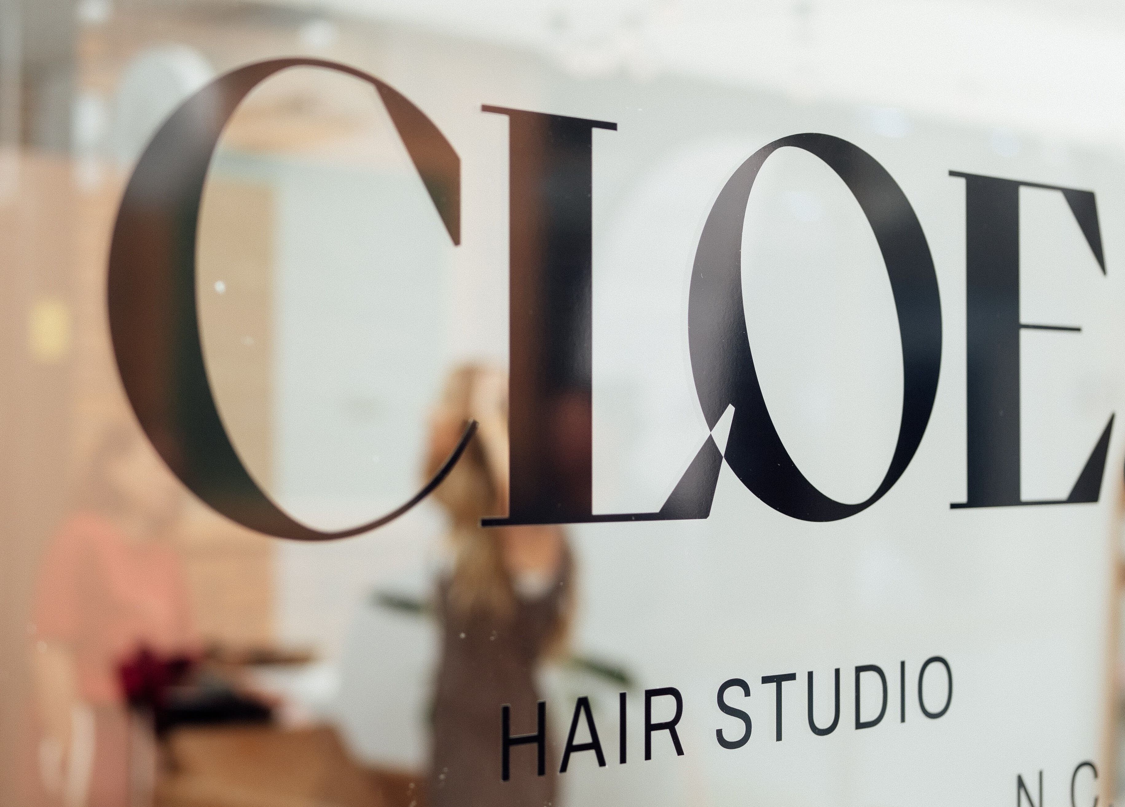 Elegant signage of Cloe. Hair Studio in Woolgoolga, New South Wales, AU, reflecting modern salon design.