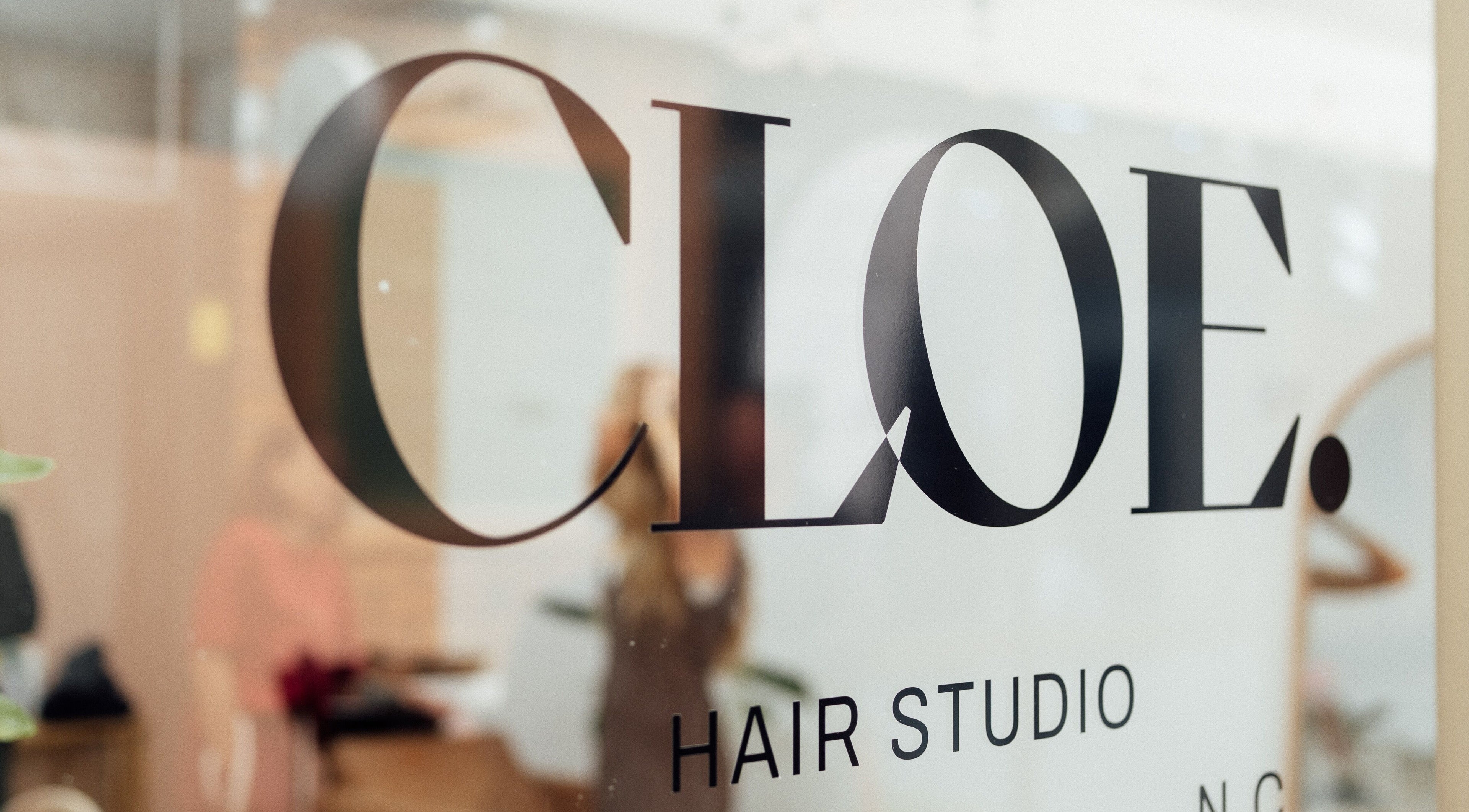 Elegant signage of Cloe. Hair Studio in Woolgoolga, New South Wales, AU, reflecting modern salon design.