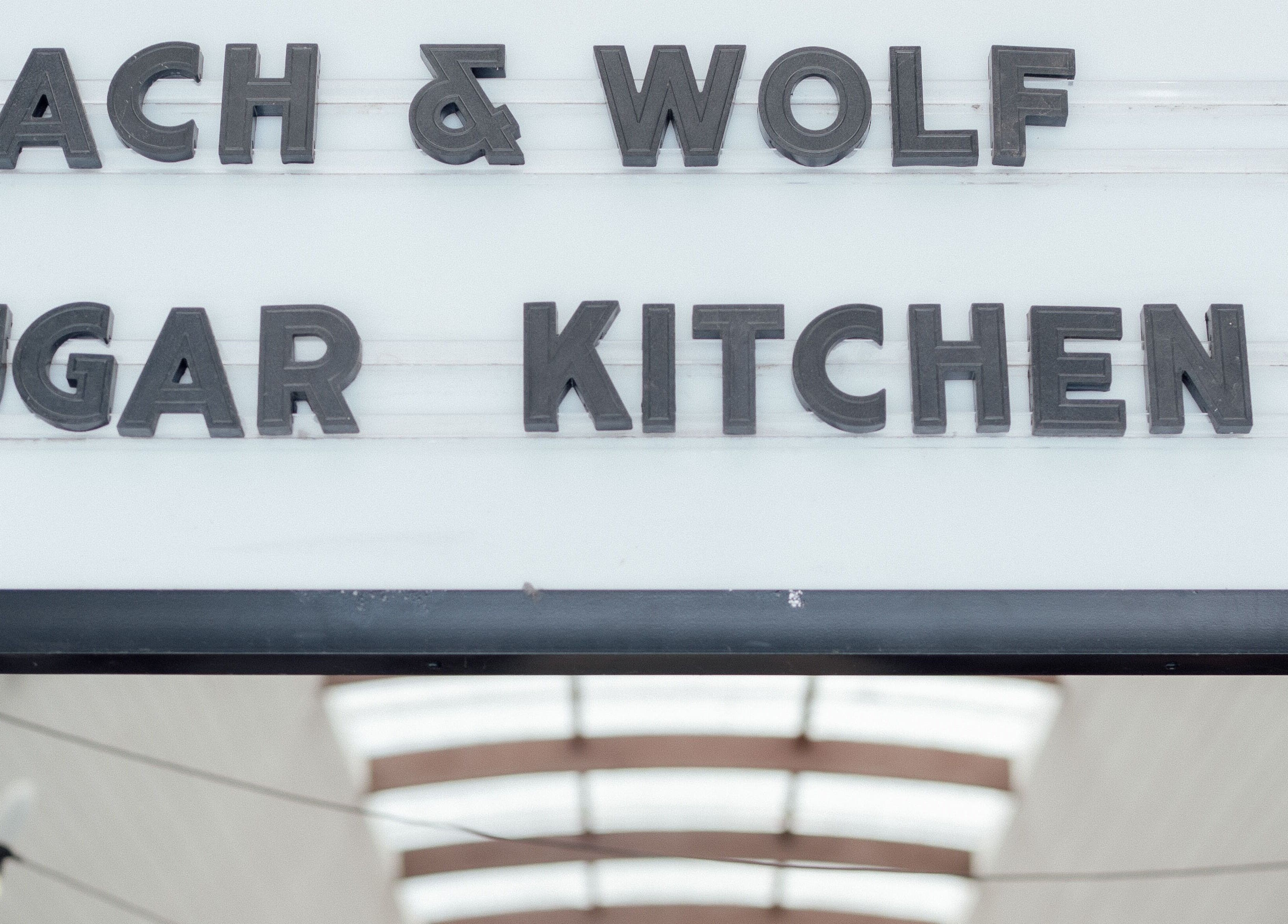 Stylish black sign at Cloe. Hair Studio, Woolgoolga, New South Wales, AU, showcasing modern design.