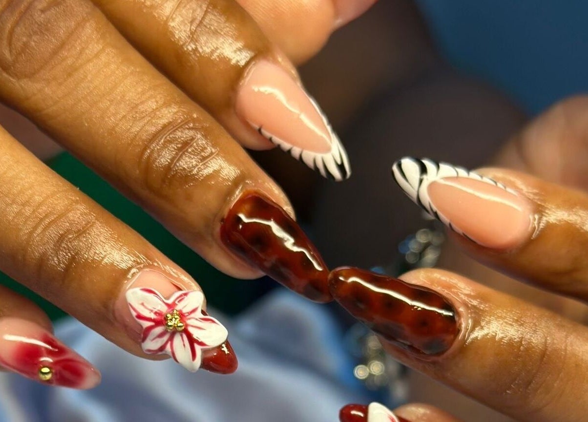 Intricate nail art at TNP Salon, Nassau, New Providence, BS, showcasing unique designs and vibrant colors.