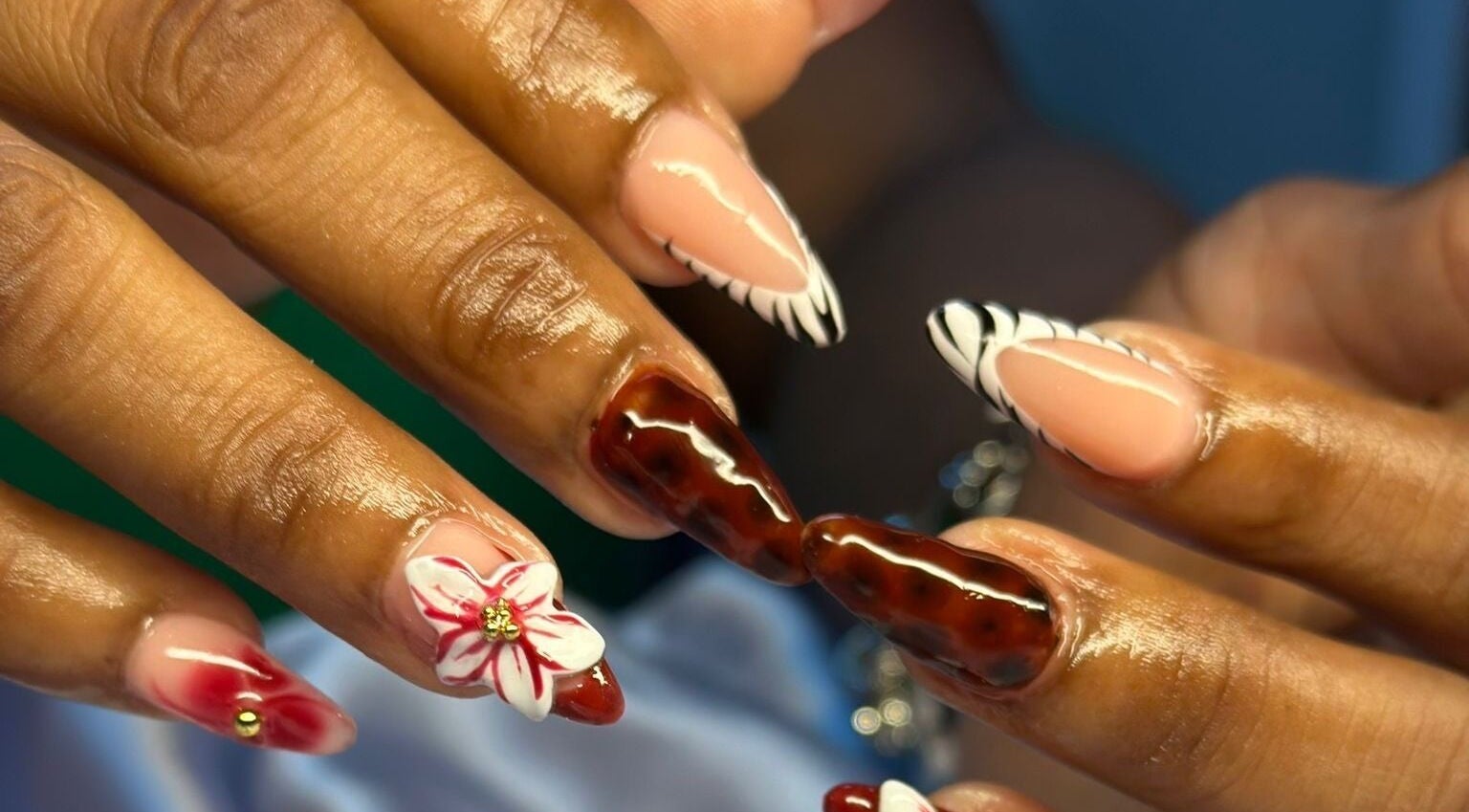 Intricate nail art at TNP Salon, Nassau, New Providence, BS, showcasing unique designs and vibrant colors.