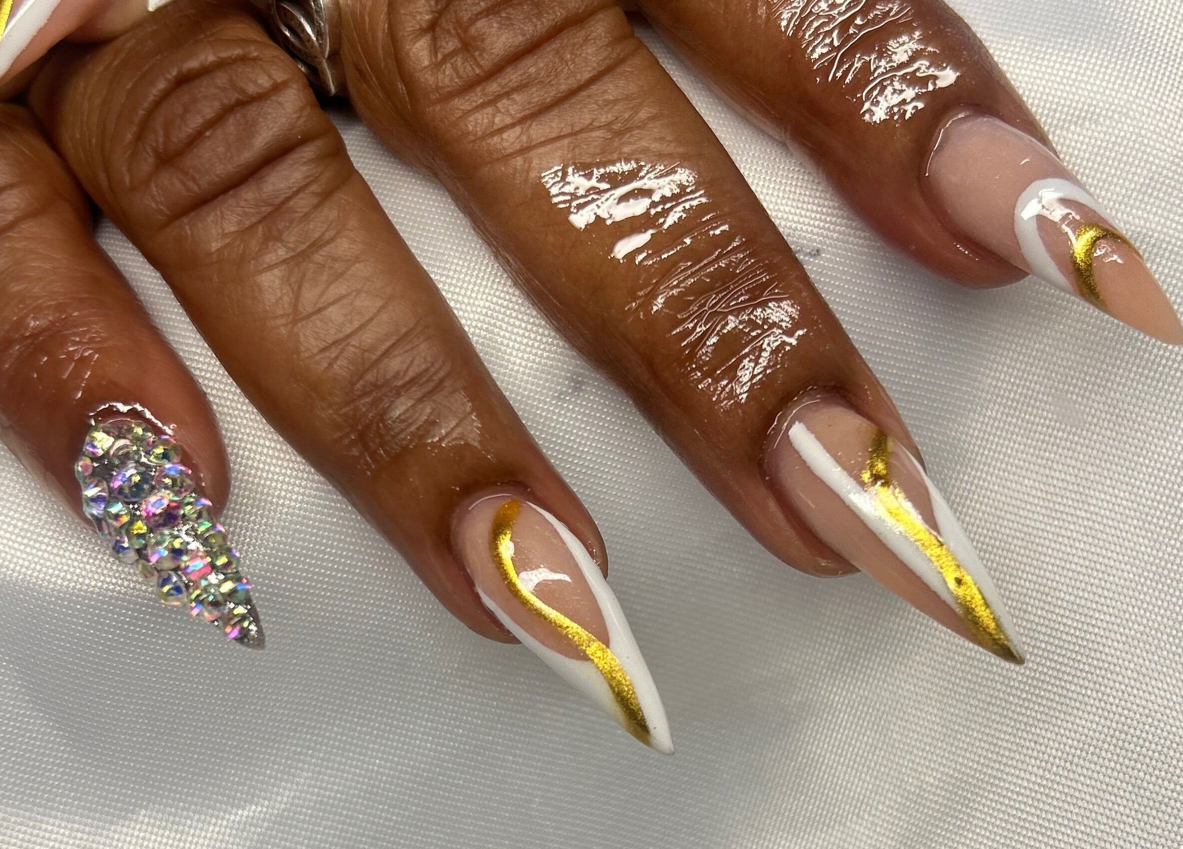 Elegant gold and jewel nail art at TNP Salon, Nassau, New Providence, BS.
