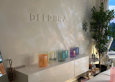Relaxing spa ambiance at Deephra, New York, New York, US, with colorful candle holders and serene decor.