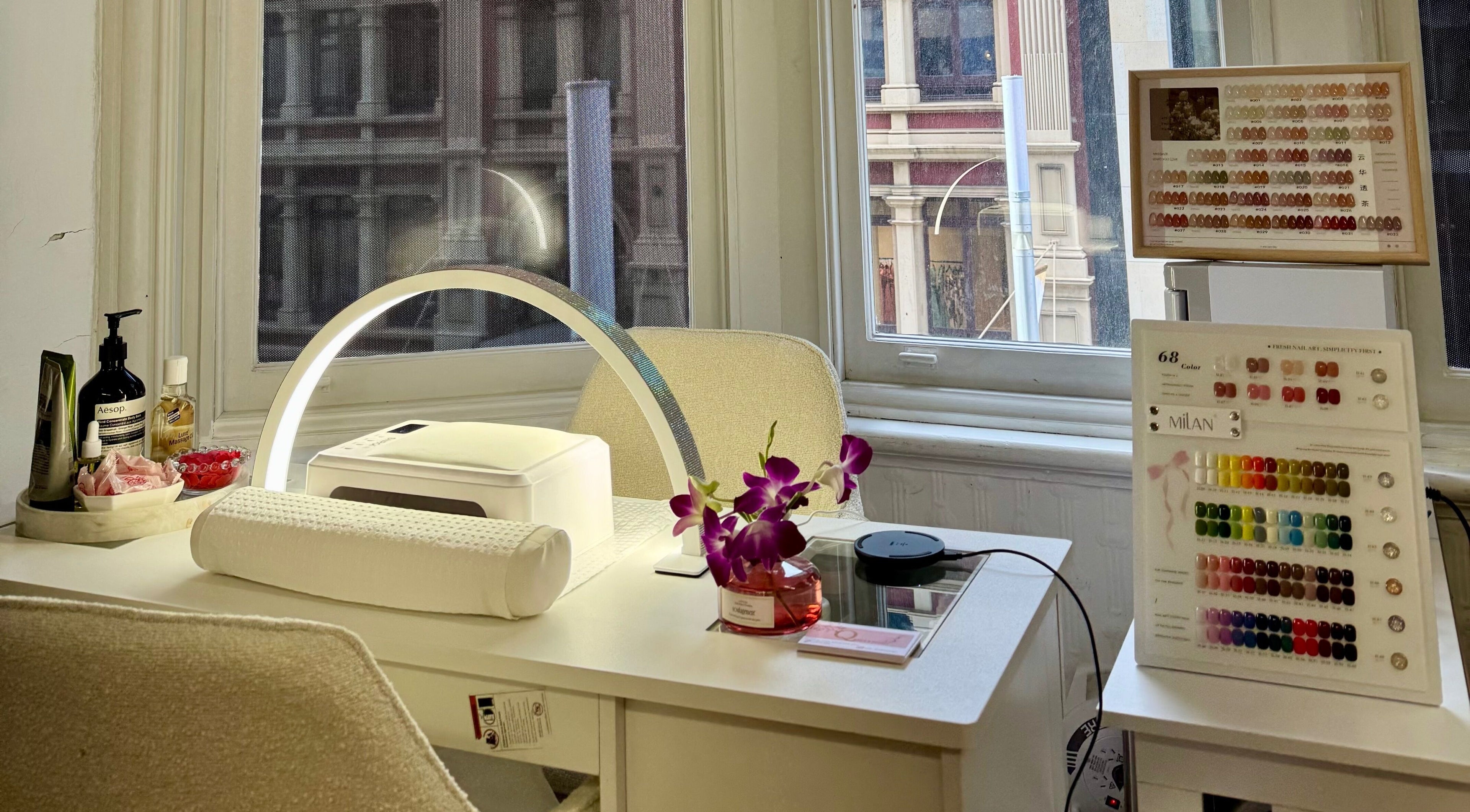 Elegant nail station at Q Nails & Design Sydney, featuring tools and vibrant color palettes in Sydney, New South Wales, AU.