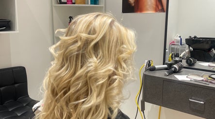 Blonde hair styled in waves at Leila Hair Studio, Newmarket, Ontario, CA, highlighting salon's hair services.
