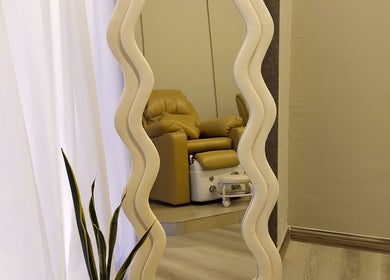 Cozy lounge at Chillax Beauty, Kuala Lumpur, Wilayah Persekutuan Kuala Lumpur, MY featuring a wavy mirror.