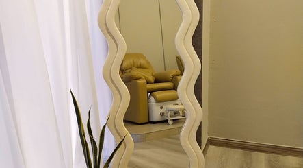 Cozy lounge at Chillax Beauty, Kuala Lumpur, Wilayah Persekutuan Kuala Lumpur, MY featuring a wavy mirror.